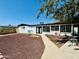 Charming home with a low maintenance front yard, sidewalk, and a door with large window panes at 1941 E Ellis Dr, Tempe, AZ 85282
