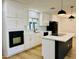 Bright, updated kitchen featuring white cabinets, black appliances, modern lighting and eat-in island at 1941 E Ellis Dr, Tempe, AZ 85282