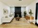 Cozy living room featuring a modern fireplace, hardwood floors, stylish furniture and elegant decor at 1941 E Ellis Dr, Tempe, AZ 85282