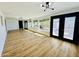 Bright living room featuring wood-look flooring, lots of windows and modern lighting at 1941 E Ellis Dr, Tempe, AZ 85282