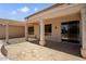 Covered back patio overlooking landscaped yard, perfect for outdoor entertaining and leisure at 20007 N Siesta Rock Dr, Surprise, AZ 85374