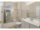 Bathroom featuring a shower-tub combination with glass doors, a toilet, and vanity with sink at 20007 N Siesta Rock Dr, Surprise, AZ 85374