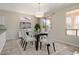 Virtually staged dining room with modern table, chairs, and decor at 20007 N Siesta Rock Dr, Surprise, AZ 85374