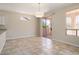 Open concept dining room with large windows and outdoor access at 20007 N Siesta Rock Dr, Surprise, AZ 85374