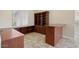A spacious home office with custom built-in shelving and desk offers ample storage at 20007 N Siesta Rock Dr, Surprise, AZ 85374