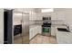 Modern kitchen featuring stainless steel appliances and white cabinetry at 20007 N Siesta Rock Dr, Surprise, AZ 85374
