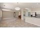 Open concept living space with carpeted living room and tiled kitchen at 20007 N Siesta Rock Dr, Surprise, AZ 85374