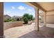 Covered patio overlooking the backyard landscaping creating an ideal outdoor living space at 20007 N Siesta Rock Dr, Surprise, AZ 85374