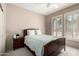 The bedroom features a ceiling fan, plantation shutters, neutral paint and carpeted floors at 20223 N Sundance Way, Surprise, AZ 85374