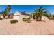 Beautiful desert home with desert landscaping, and a two-car garage, showcasing curb appeal at 20223 N Sundance Way, Surprise, AZ 85374