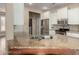 Kitchen with granite countertops, stainless steel appliances, including microwave, and a view of laundry room at 20223 N Sundance Way, Surprise, AZ 85374