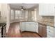 Bright kitchen featuring granite countertops, stainless steel appliances, and a breakfast nook with shuttered windows at 20223 N Sundance Way, Surprise, AZ 85374
