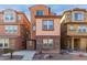 Charming two-story home featuring a stone facade, complemented by desert landscaping and a well-maintained exterior at 2028 N 77Th Ln, Phoenix, AZ 85035