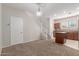Cozy living room with plush carpet, neutral walls, and a staircase leading to the upper level at 2028 N 77Th Ln, Phoenix, AZ 85035