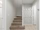 Neutral staircase features plush carpet steps, and crisp white molding at 2028 N 77Th Ln, Phoenix, AZ 85035