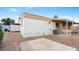 A mobile home with an air conditioner, patio, and rock landscaping at 2121 N Center St # 198, Mesa, AZ 85201
