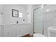 A well-lit bathroom featuring a toilet, mirror, shower, and vanity at 2121 N Center St # 198, Mesa, AZ 85201