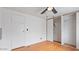 Bedroom featuring wood floors and a closet with sliding doors at 2121 N Center St # 198, Mesa, AZ 85201