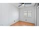 A well-lit bedroom features wood-look flooring, a ceiling fan, and a window at 2121 N Center St # 198, Mesa, AZ 85201