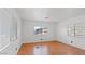 Well-lit bedroom featuring wood floors and large window with blinds at 2121 N Center St # 198, Mesa, AZ 85201