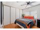 Comfortable bedroom with a ceiling fan, window, and a closet with sliding doors at 2121 N Center St # 198, Mesa, AZ 85201