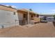 A home's exterior featuring an AC unit, patio and beige exterior at 2121 N Center St # 198, Mesa, AZ 85201