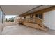 Covered patio with wood railing and ramp access to property at 2121 N Center St # 198, Mesa, AZ 85201
