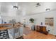 Bright kitchen with butcher block countertops, a gas stove, stainless steel sink, and white cabinets at 2121 N Center St # 198, Mesa, AZ 85201