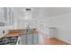 Bright kitchen featuring a stainless steel sink, and white appliances at 2121 N Center St # 198, Mesa, AZ 85201