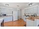 Functional kitchen with white appliances, wood countertops, and a gas range stove at 2121 N Center St # 198, Mesa, AZ 85201
