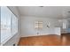 Bright living room with wood floors, white walls, and several windows at 2121 N Center St # 198, Mesa, AZ 85201