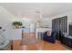 Cozy living room with a neutral palette, wood flooring, and an open floor plan leading to the kitchen at 2121 N Center St # 198, Mesa, AZ 85201