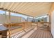 The covered patio features wood flooring, railings and a matching awning at 2121 N Center St # 198, Mesa, AZ 85201