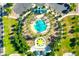 Aerial view showcases a community pool, playground, green space, mature landscaping and ample parking at 22121 N Greenland Park Dr, Maricopa, AZ 85139