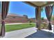 Beautiful backyard with green grass, mature landscaping, and a built in BBQ at 22121 N Greenland Park Dr, Maricopa, AZ 85139