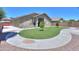 A landscaped backyard featuring a circular sidewalk at 22121 N Greenland Park Dr, Maricopa, AZ 85139