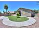 Beautiful backyard featuring lush green lawn and a manicured landscaping at 22121 N Greenland Park Dr, Maricopa, AZ 85139