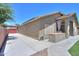 View of the home's exterior and private backyard featuring a concrete patio at 22121 N Greenland Park Dr, Maricopa, AZ 85139