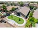 Aerial view of backyard featuring a grass lawn, patio and solar panels at 22121 N Greenland Park Dr, Maricopa, AZ 85139