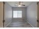 Clean bedroom with neutral paint and wood-look flooring at 22121 N Greenland Park Dr, Maricopa, AZ 85139