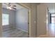 Clean bedroom with neutral paint and wood-look flooring at 22121 N Greenland Park Dr, Maricopa, AZ 85139