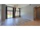 Bright living room with lots of natural light, new laminate floors and neutral paint at 22121 N Greenland Park Dr, Maricopa, AZ 85139