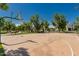 Community basketball court surrounded by mature trees and landscaping at 24348 S 201St Ct, Queen Creek, AZ 85142