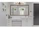 Bright bathroom with custom vanity, quartz countertop and decorative mirror at 24348 S 201St Ct, Queen Creek, AZ 85142