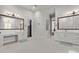 Spacious bathroom features dual vanities, tile floors and modern lighting at 24348 S 201St Ct, Queen Creek, AZ 85142