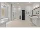 Elegant bathroom features a soaking tub, glass shower and dual sinks at 24348 S 201St Ct, Queen Creek, AZ 85142