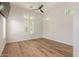 Bedroom featuring laminate flooring, modern ceiling fan, recessed lighting, and plenty of natural light at 24348 S 201St Ct, Queen Creek, AZ 85142