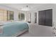Spacious bedroom with carpeting, gray accents, large windows, and a ceiling fan at 24348 S 201St Ct, Queen Creek, AZ 85142