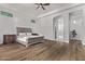 Bright bedroom features tray ceilings and an ensuite bathroom at 24348 S 201St Ct, Queen Creek, AZ 85142