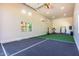 Bright bonus room with tall ceilings, natural light, and ample space for exercise equipment at 24348 S 201St Ct, Queen Creek, AZ 85142